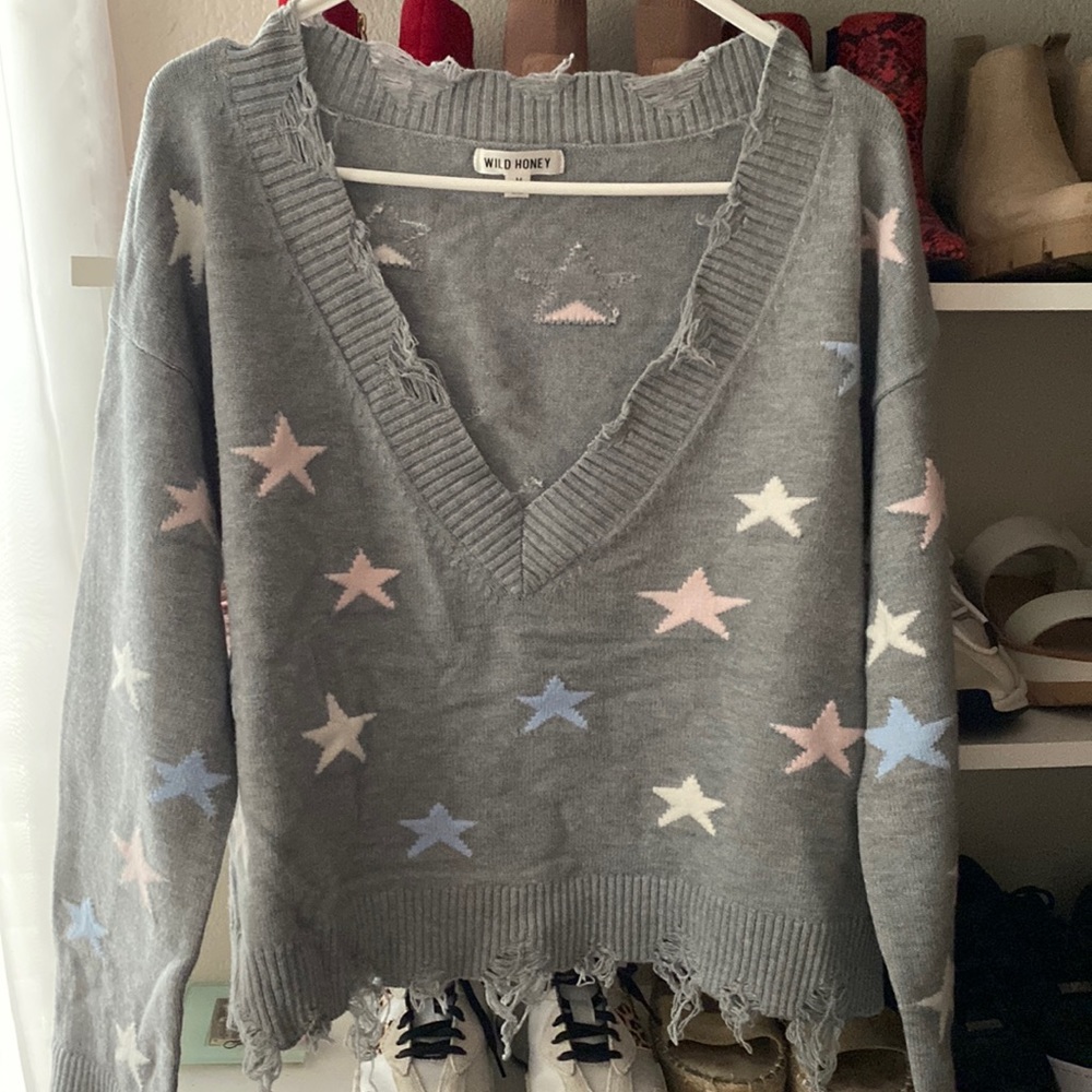 Stars sweater bought it at a local boutique. Super cute and in great condition